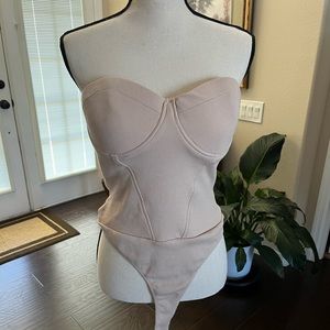 Women’s beige Strapless beige bodysuit.